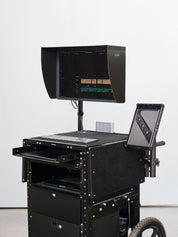 Carbon Fibre Hood for eizo screen, mounted on an inovativ deploy type cart.  Additional iPad Pro used as a vertical screen on an xLamina iPad mounting system